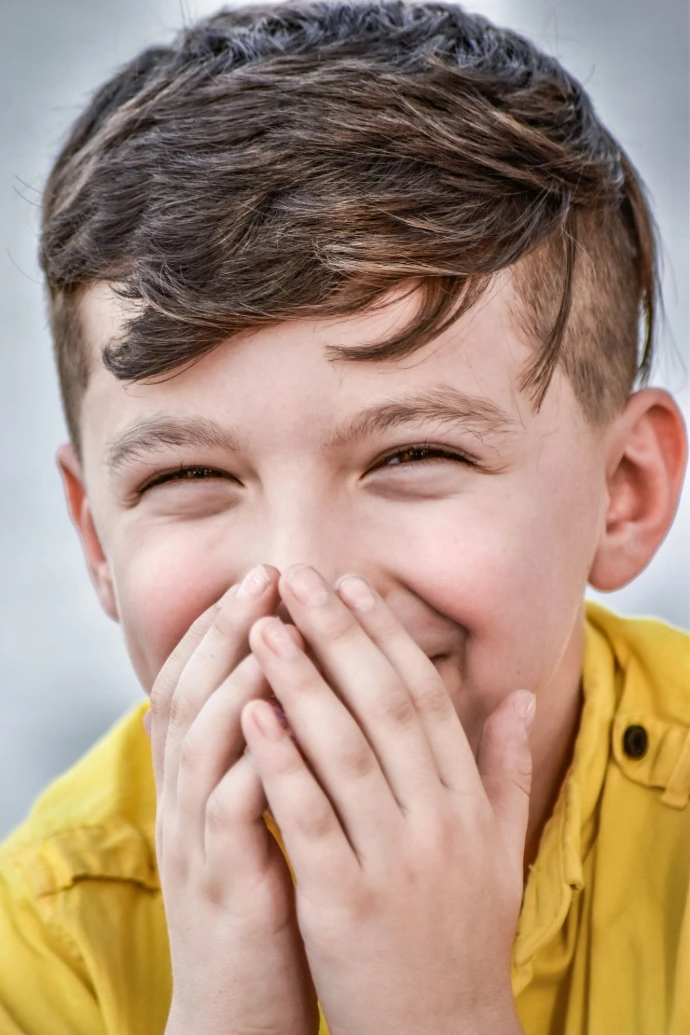 a person covering the face with the hands